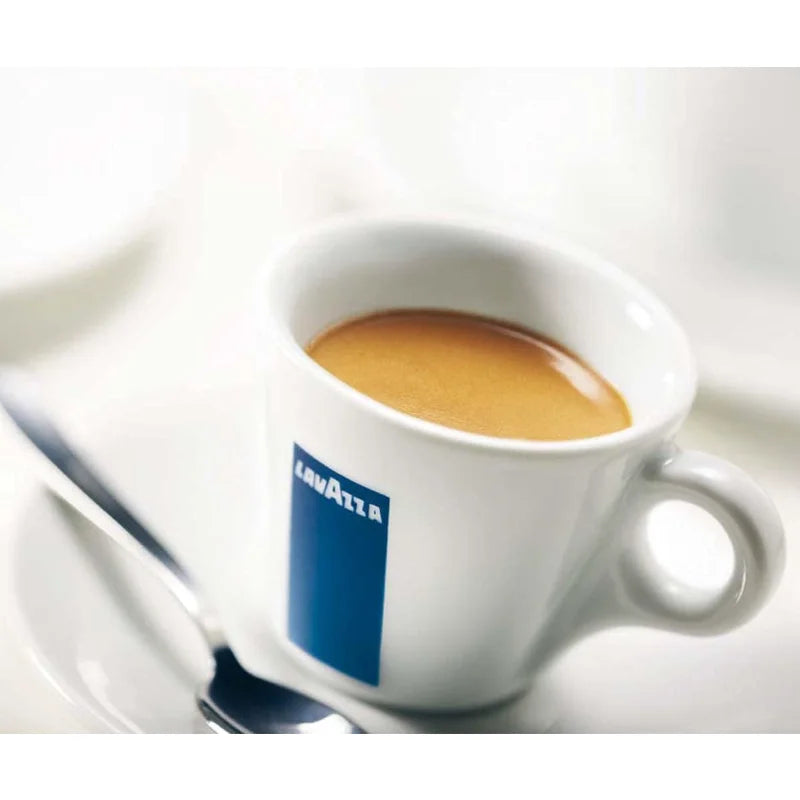 White coffee cup with espresso and a visible Lavazza logo on a white background